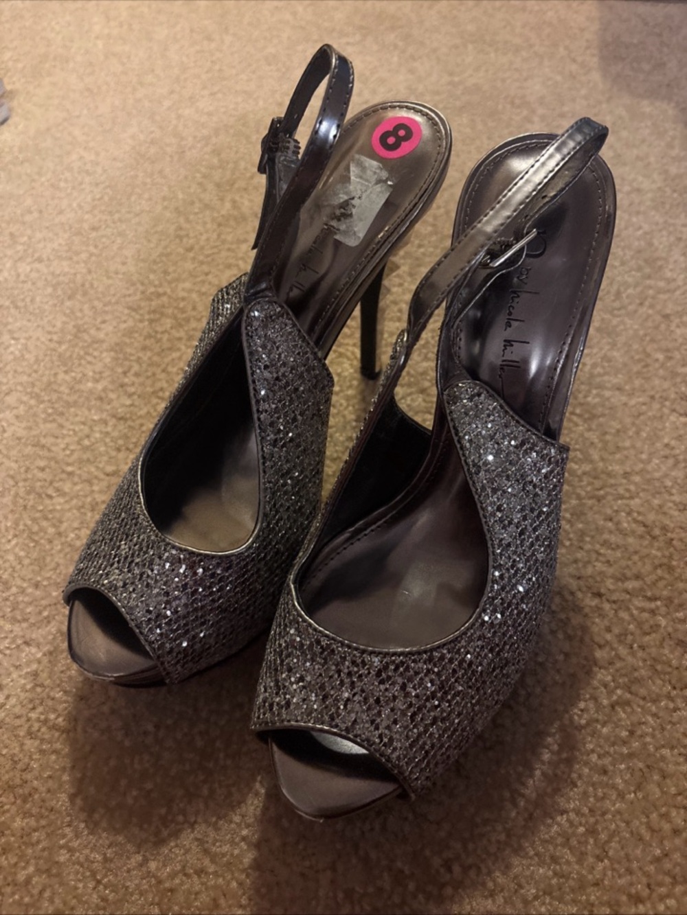 N by Nicole Miller silver glitter peep-toe slingback heels.